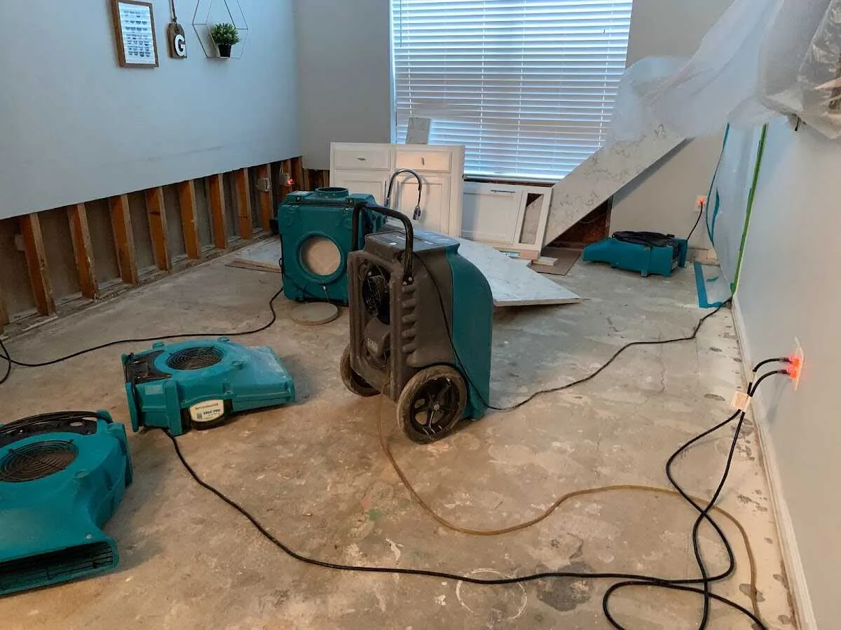 Dehumidifier in flood-cut room for Water Damage Restoration in Lennox